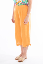 Load image into Gallery viewer, Jump - 3/4 Pleat Detail Pant in Mandarin colour side shot
